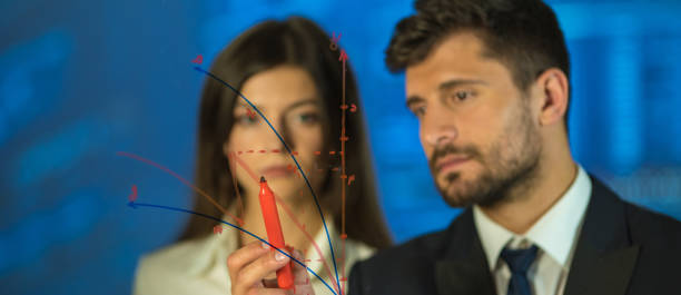 istock The man and woman drawing on the virtual board 1321708631