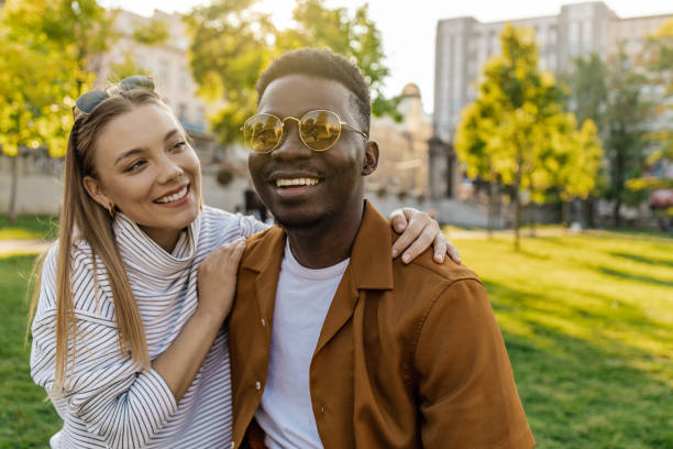 istock Interracial couple embracing outdoors and having great time 1321710453