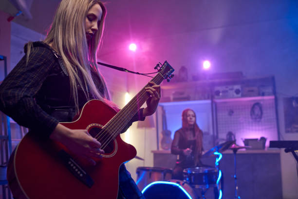 Woman Playing the Guitar/Studio Shot