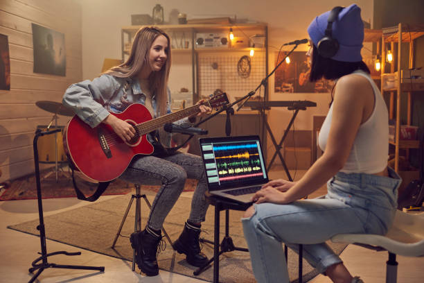 istock Two young women recording new music in studio 1321711676
