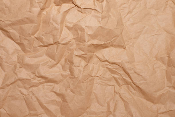istock crumpled brown paper close-up. background for your mockup 1321712027
