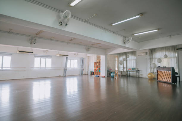 istock empty dance studio with wooden flooring, window ,barre 1321713710