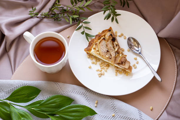 Beautiful breakfast with cottage cheese, pear pie and tea