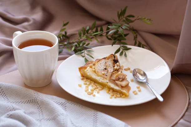 istock Beautiful breakfast with cottage cheese, pear pie and tea 1321715553