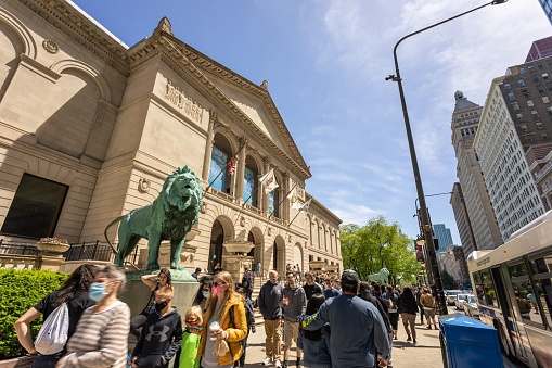 Chicago, United States - May 30, 2021: Wide view of many tourists walking by the Art Institute of Chicago