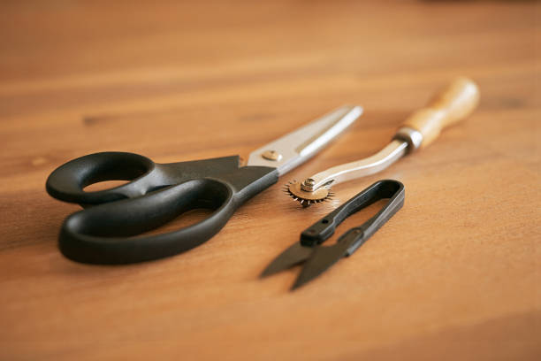 istock Shot of sewing supplies on a table in an empty studio during the day 1321722194