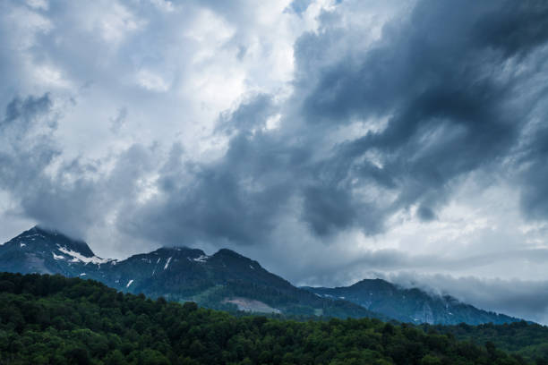 istock Stormy clouds above Caucasus mountains. 1321723758