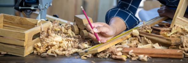 istock A carpenter is making crafts from wood. 1321727832