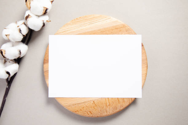 istock White invitation card on a wood with cotton 1321728136