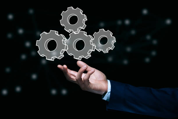 istock Business man holding gear icon 1321728473