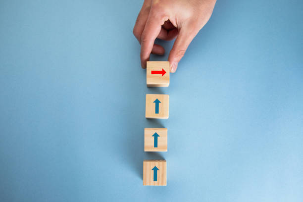 istock Wooden cubes to the top with arrows. 1321728501