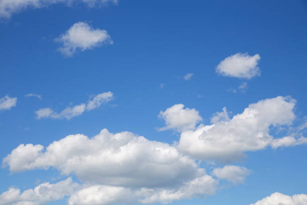 istock blue sky with white clouds of various shapes, sunny day, texture 1321728507
