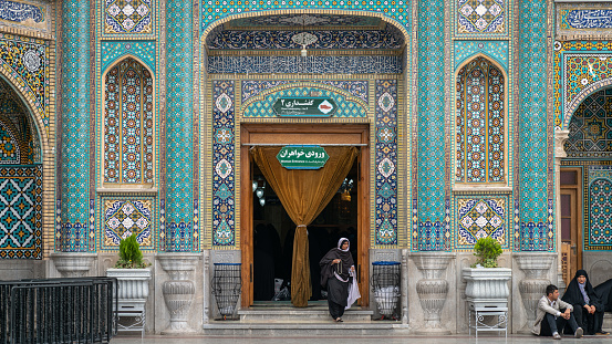 Shrine of Fatima Masumeh, Qom, Iran - May 2019: Iranian women walking inside Shrine of Fatima Masumeh in Qom, which is considered by Shia Muslims to be the second most sacred city in Iran.