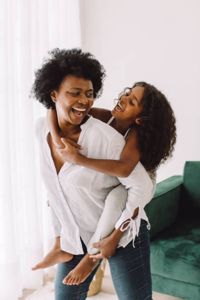 istock Girl having fun with grandma at home 1321733203
