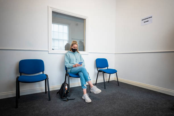 istock Waiting to be Called in for her Vaccine 1321735922