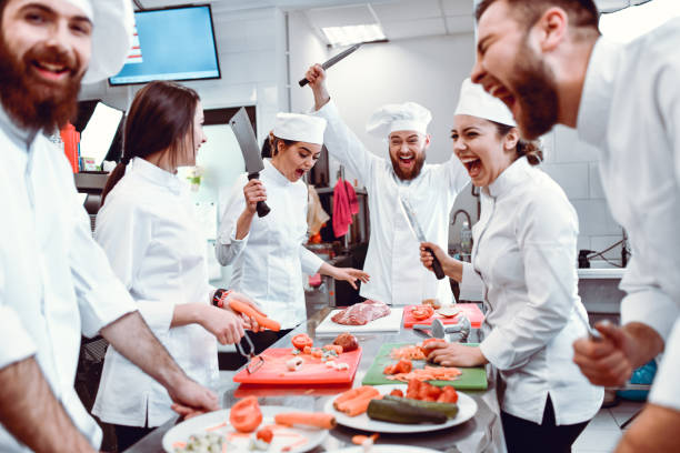 istock Male Winning Cooking Competition Among Colleagues In Restaurant Kitchen 1321736037