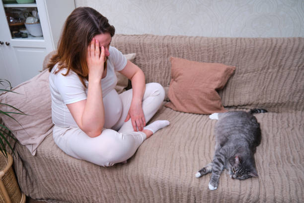 istock Pregnant woman holding her head, problems and fatigue during pregnancy 1321752373