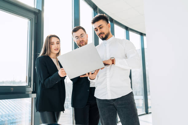 istock Business team with laptop at office 1321752734