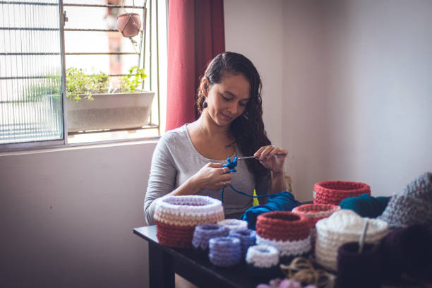 istock Woman producing crochet art for decoration 1321754333