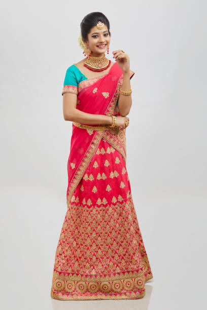 istock Beautiful smiling Indian bride with jewelry in studio shot. 1321754686