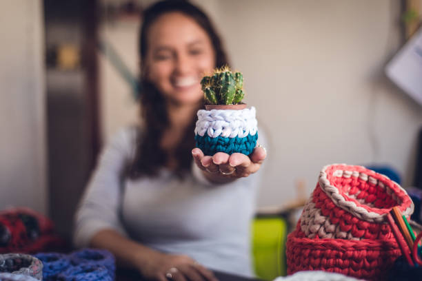 istock Successful entrepreneur showing her crochet production 1321754784