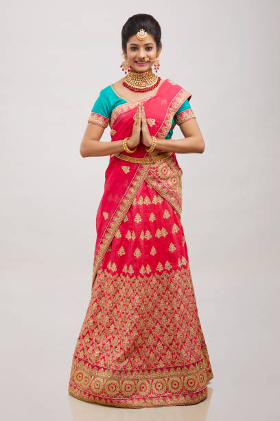 istock Beautiful smiling Indian bride greeting with jewelry 1321754813