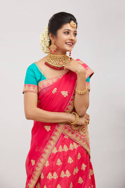 istock Beautiful smiling Indian bride with jewelry in studio shot. 1321754847