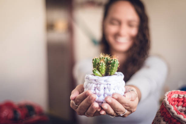 istock Craftswoman showing her crochet production 1321754929