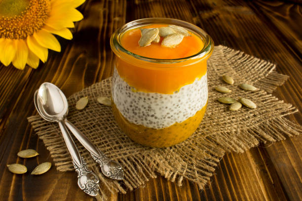 istock Pudding with chia seed  and  pumpkin  on the rustic wooden background 1321756747