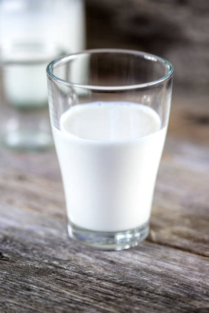 istock Pouring a glass of fresh milk 1321757340