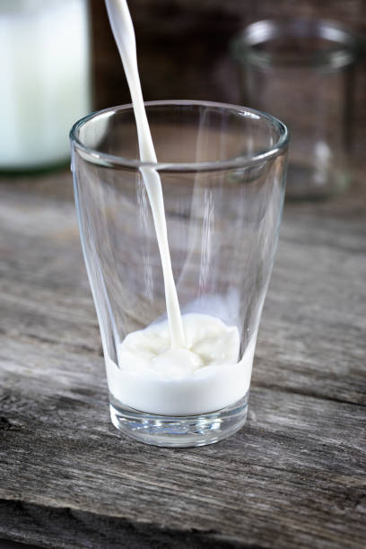 istock Pouring a glass of fresh milk 1321757358