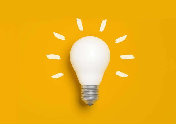 istock White light bulb on yellow background, concept of idea and creativity 1321760717
