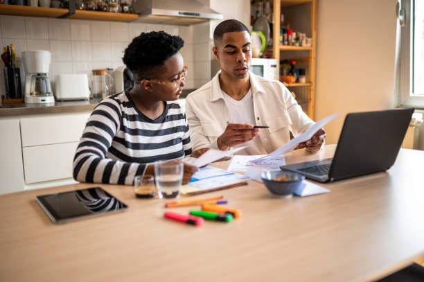 istock Young couple looking in their bills 1321763643