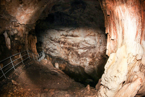 istock Passage into the depths of the cave. 1321764359