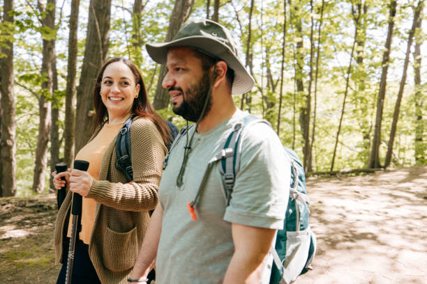 istock Couple walking in the forest during their one day trip 1321765579