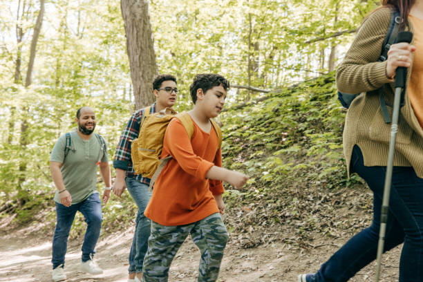 istock Family hiking with backpacks 1321765926