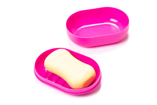istock Soap in PLASTIC COLORED soap dish isolated on white background 1321768437