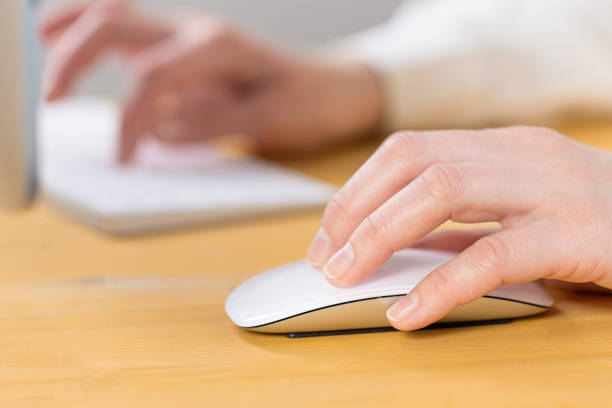 istock Close-up of young female hands pressing keyboard buttons and using a mouse. work from home. office. shopping 1321768483