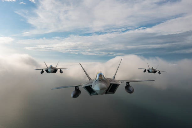 istock Jet fighters flying over the clouds. 1321770705