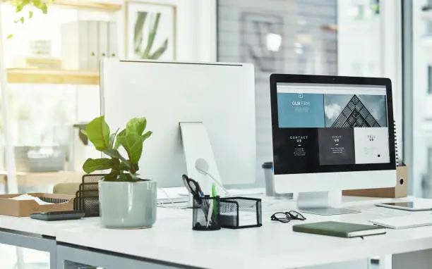 Photo of Shot of a workstation in a modern office with no people