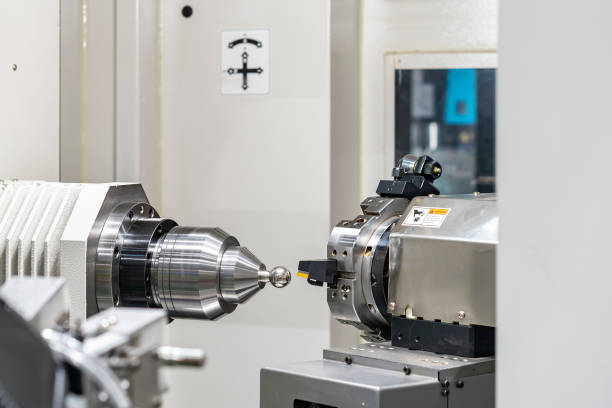 istock Metal work piece or product molded by precision automatic 4 axis cnc turning center horizontal lathe machine in industrial work 1321780250