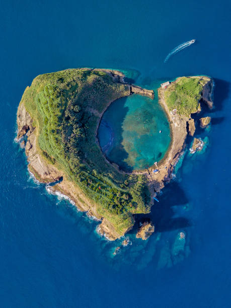 Azores aerial panoramic view. Top view of Islet of Vila Franca do Campo. Crater of an old underwater volcano. San Miguel island, Azores, Portugal. Heart carved by nature. Bird eye view. Azores aerial panoramic view. Top view of Islet of Vila Franca do Campo. Crater of an old underwater volcano. San Miguel island, Azores, Portugal. Heart carved by nature. Bird eye view. azores islands stock pictures, royalty-free photos & images