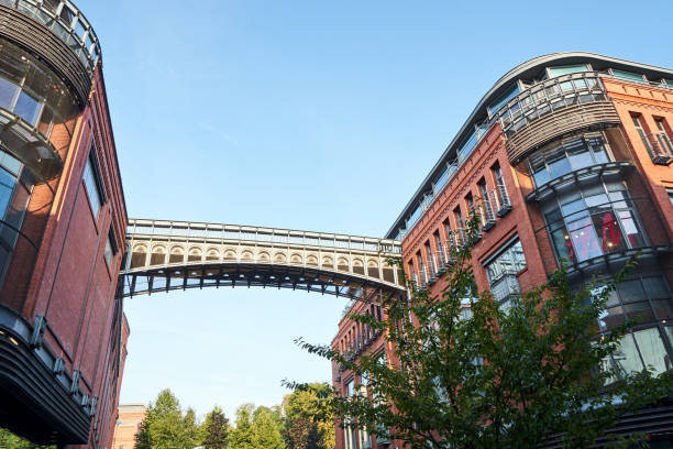 istock a metal footbridge and a historic old red brick brewery 1321782900