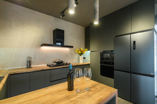 istock Modern large luxury dark gray kitchen closeup 1321783927