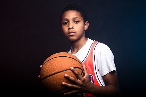 A basketball on basketball court with no people around. Concept of training, teamwork, team spirit and competition. A ball on basketball court, sports equipment only without people. Copy space.