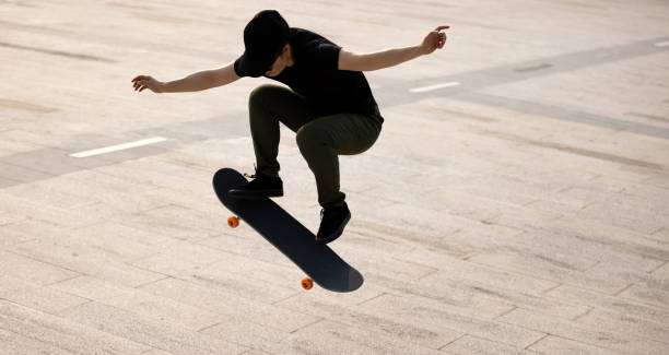 istock Skateboarder skateboarding outdoors in the morning 1321789465