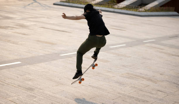 istock Skateboarder skateboarding outdoors in the morning 1321789539