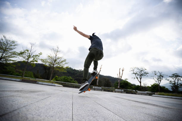 istock Skateboarder skateboarding outdoors in the morning 1321791661
