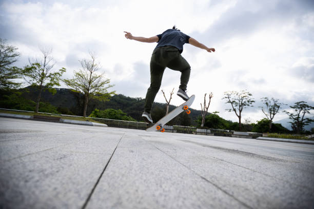 istock Skateboarder skateboarding outdoors in the morning 1321791756