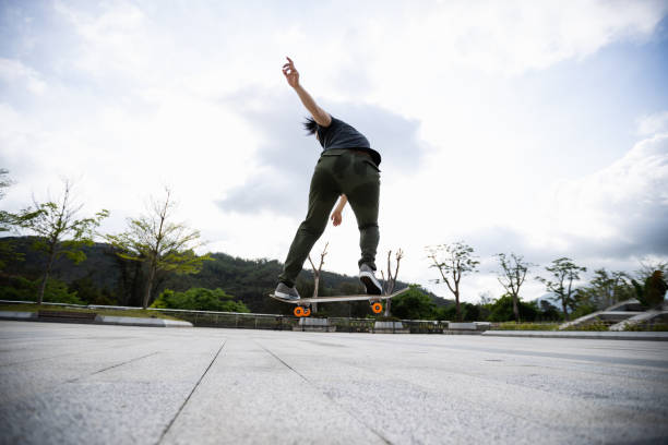 istock Skateboarder skateboarding outdoors in the morning 1321791825